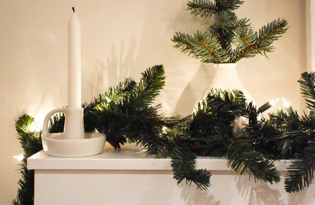 Candle and greenery holiday décor